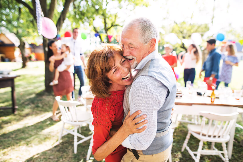 Wedding vow renewal ideas: senior couple happily dancing