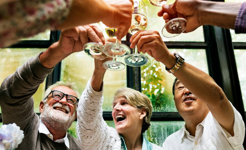 Retirement invitation wording: senior entrepreneurs having a toast