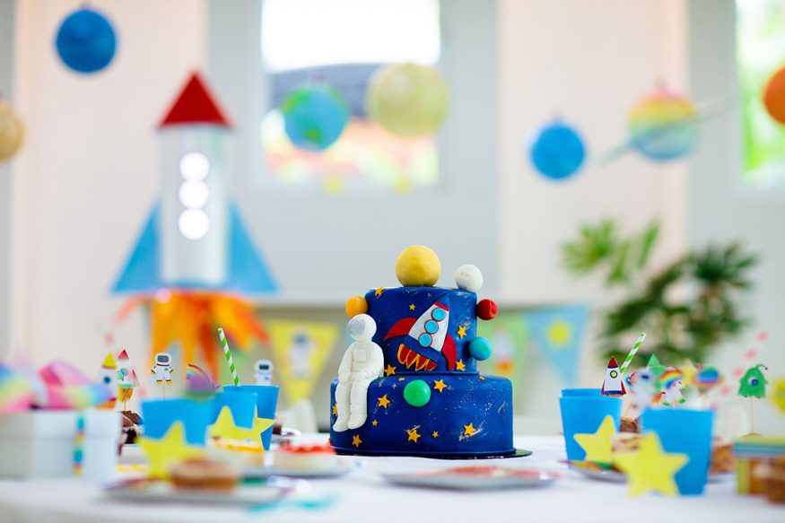 space themed party cake and decorations