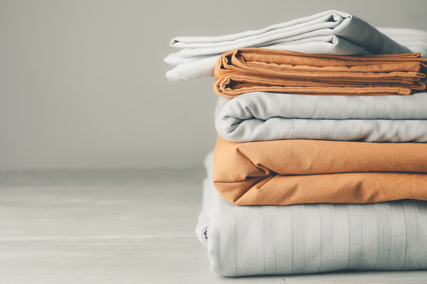 Stack of folded bed sheets