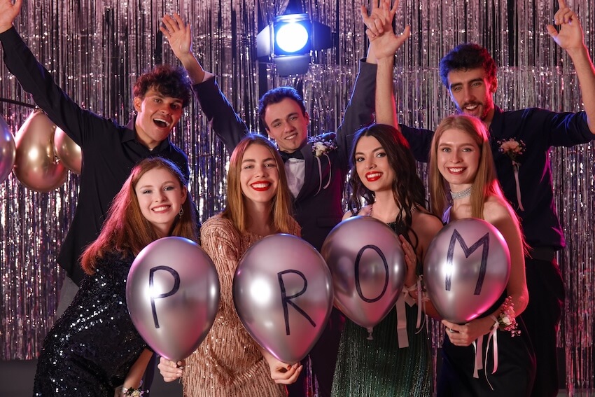 Prom invitations: teenagers posing at the camera on their prom night