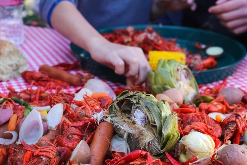 Seafood boil party ideas: Table of veggies and seafood on the table