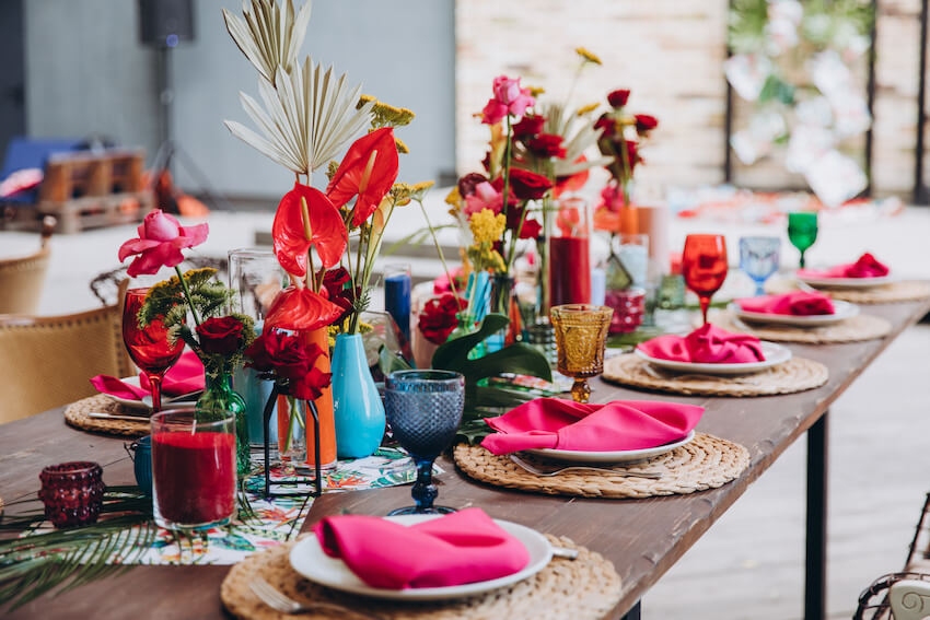 Wedding shower decorations: table decorated with flowers and pink napkins