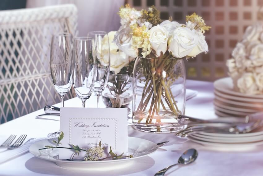 Table setting with a wedding invitation