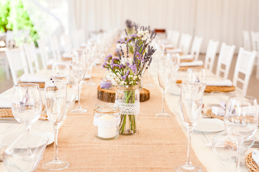 Table setting with plates, flowers, and glasses