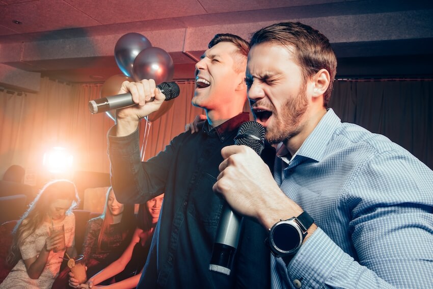 Karaoke party ideas: two men singing karaoke