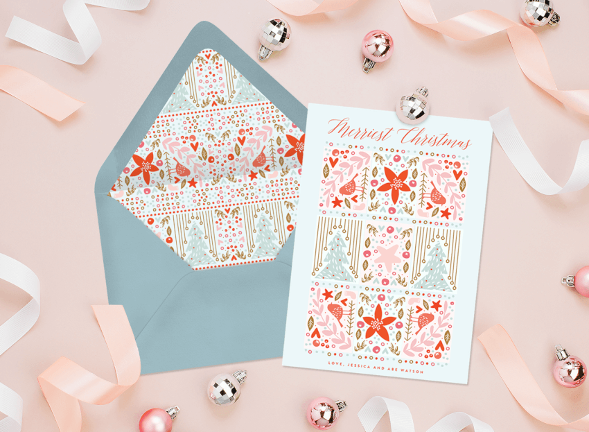 A unique Christmas card surrounded by pink ribbon and ornaments