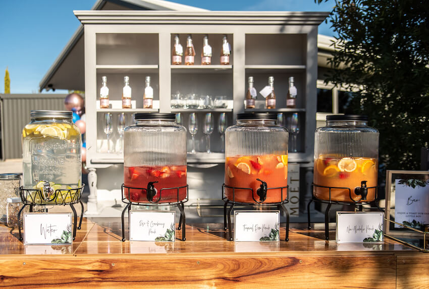 Sip and see party: various jars of drinks on a table