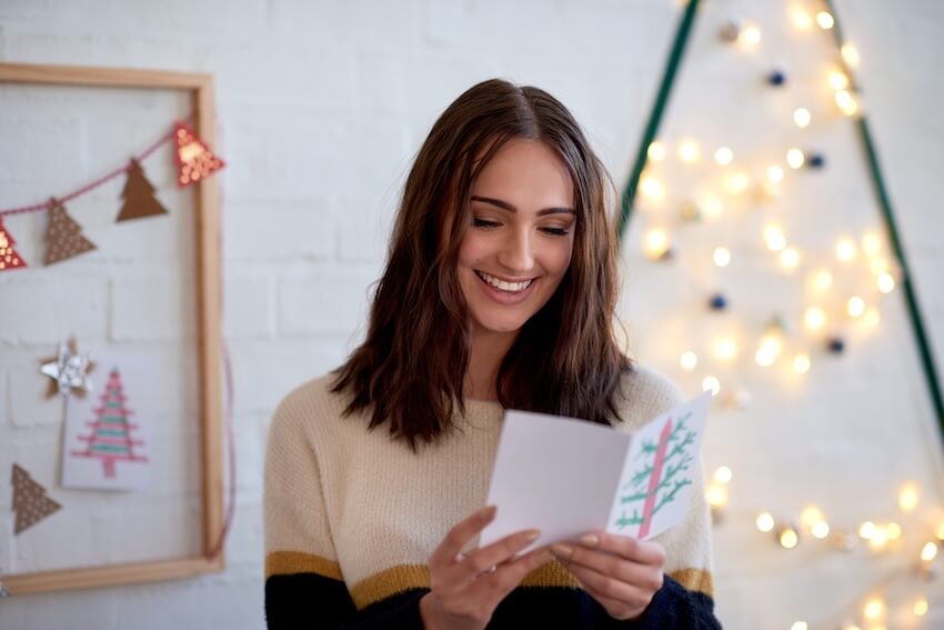 Woman reading a Christmas card