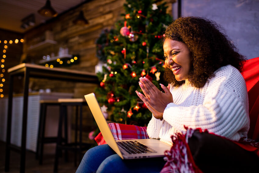 DIY Christmas cards: woman talking to someone using her laptop