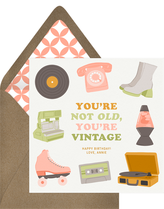 Sweet and modern birthday card. The card features mod hand-drawn illustrations of a record player, a telephone, a lava lamp, platform boots, roller skates and more. The birthday message reads, "You're not old, you're vintage."